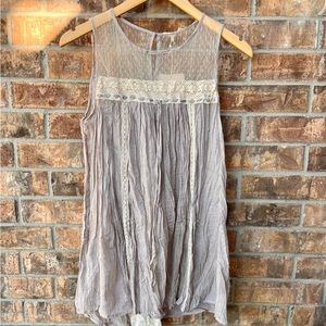 Beige tunic. Upper sheer lace front and back. Gauze fabric. Laced drape in back